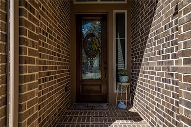 Lovely entry leads to leaded glass door