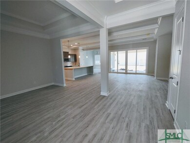 ENTRY VIEW OF FORMAL DINING AND OPEN GREAT ROOM AN