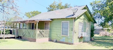 View of front of home featuring fence and a front