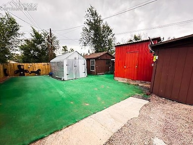 View of yard with a storage shed