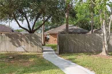 The private walkway leads from the circular driveway to the home.