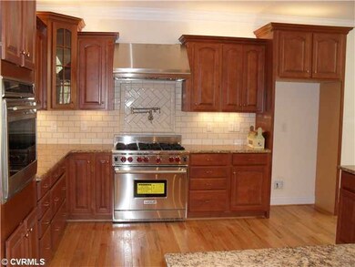 Kitchen - Gourmet eat-in kitchen features Wolf ove