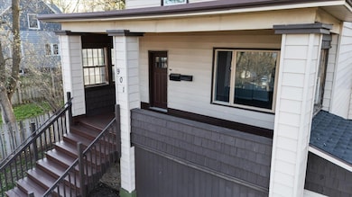 Doorway to property featuring a porch