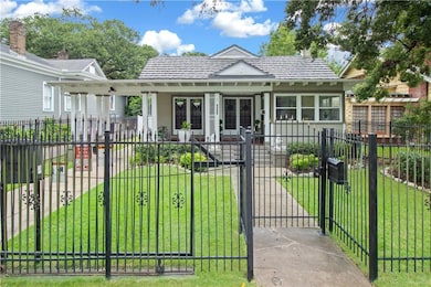 Beautiful private fenced front yard and electric driveway gate.