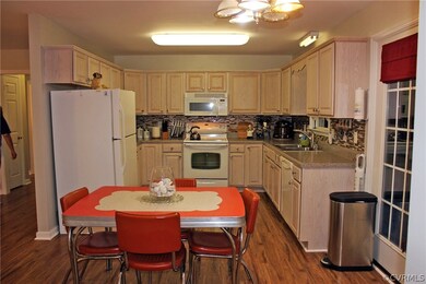 Dining area next to kitchen. French door leads out