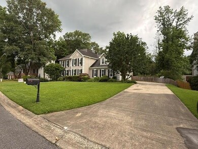 View of front of house with concrete driveway