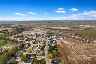 Aerial overview of property's location with nearby suburban area and rural landscape
