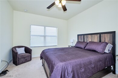 Carpeted bedroom featuring baseboards and ceiling