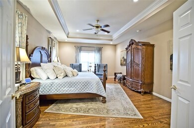 The large master bedroom entering from the master suite sitting area..