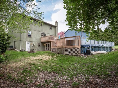 Expansive deck for the pool and a backyard firepit.