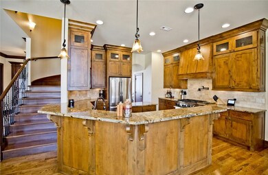 Stunning custom wood cabinets . Island and eat in