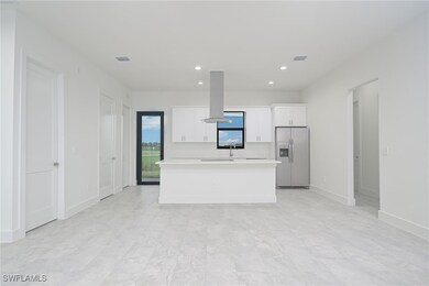 Kitchen with island exhaust hood, stainless steel