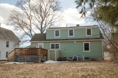 Exterior rear of home with deck,...
