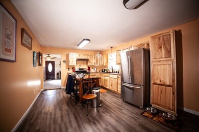 Country Kitchen with eat in area and stainless steel appliances.  