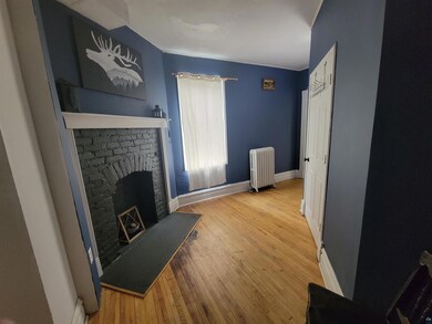 Living room with hardwood / wood-style flooring, r