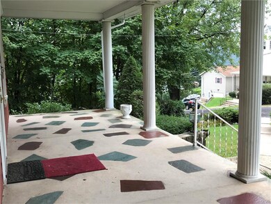 Lovely concrete front porch with view of Mt. Pisga