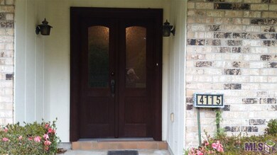 Entry doors leading to wide foyer.