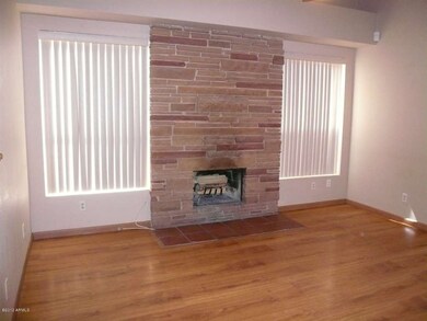 Den wth fireplace and vaulted ceilings
