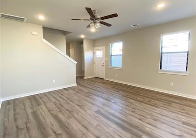 Unfurnished living room with wood finished floors