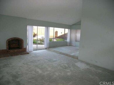 Large living room with brick fireplace
