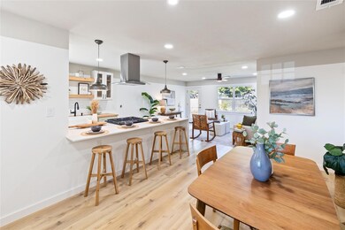 Dining room with ceiling fan, sink, and light hard