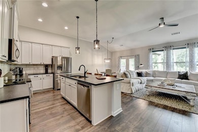 Kitchen featuring a sink, stainless steel applianc