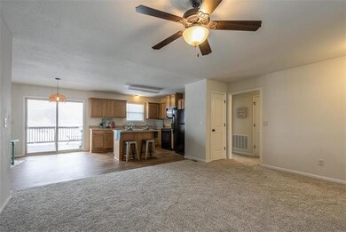Living area is open to the kitchen, for easy enter