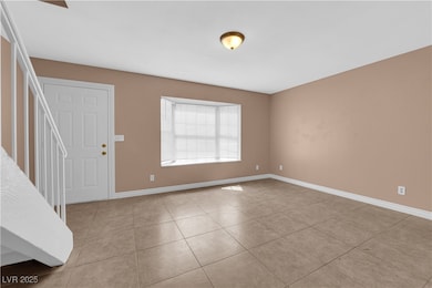 Entrance foyer featuring light tile patterned floo