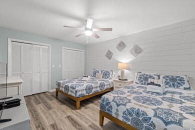 Bedroom with hardwood / wood-style floors, ceiling