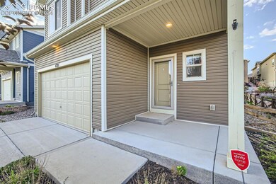 Entrance to property featuring a garage