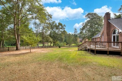Rear view of yard and deck