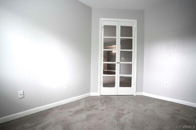 Carpeted office off of Living Room