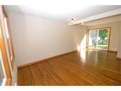 Warm and inviting living room with gleaming oak ha