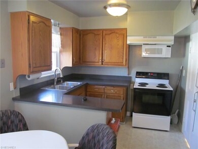 Well maintained eat in kitchen features fresh pain