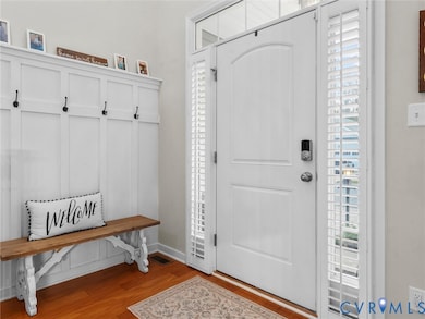 Mudroom with light wood finished floors