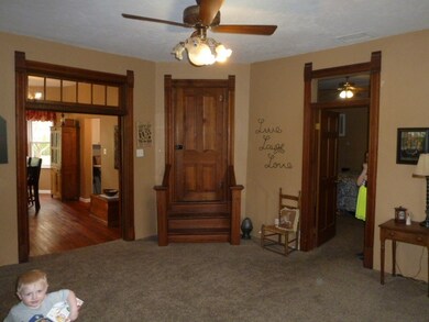 First room when entering the home. Closed door is 