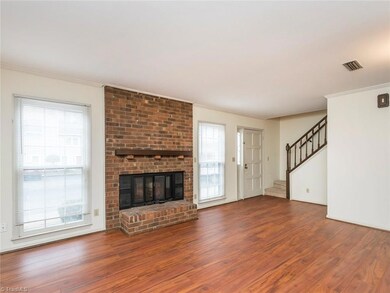 Home offers a lot of living space, wood burning fireplace and includes a coat closet at base of stairs.