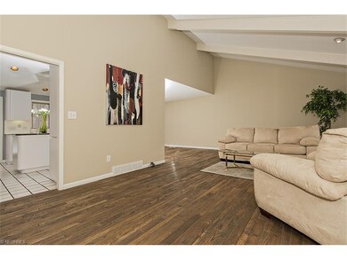 Spacious Living Room with Vaulted Beamed Ceiling a