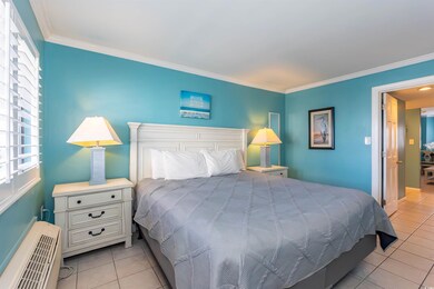 Bedroom featuring light tile patterned floors, a w