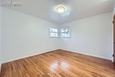 Spare room with wood-type flooring