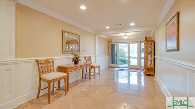 The wide and generous foyer sets the stage for the