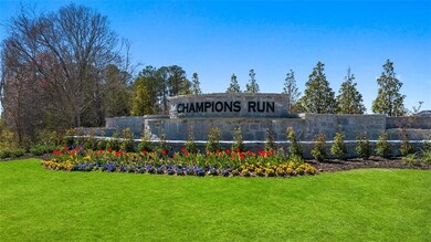 Community sign featuring a yard