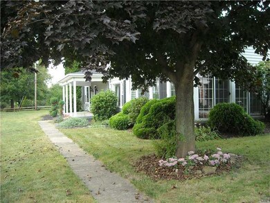 Exterior Front. Walkway to a  small piece of Heave