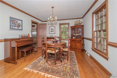 Dining room with two doorways to kitchen.