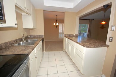 Kitchen has additional cabinets, new countertops, 