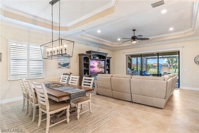 Tiled dining area with ceiling fan with notable ch