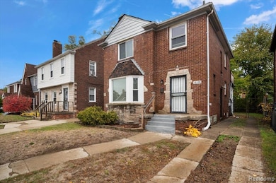 Traditional-style house with brick siding