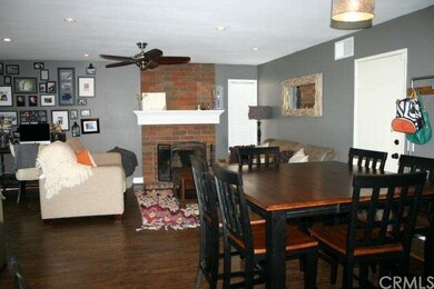 Family room with the brick fireplace.  Ceiling fan