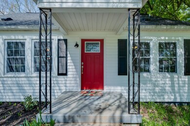 Brand New Doors, Windows, Siding, Shutters....hardly anything that hasn't been replaced or renewed in this beautiful cottage.  Covered Front Porch & Back Porch, which is right off the Dining and Kitchen for your back yard entertaining!