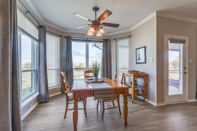 Dining area with a wealth of natural light and cei